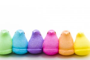 Rainbow color marshmallow peeps and jelly beans.